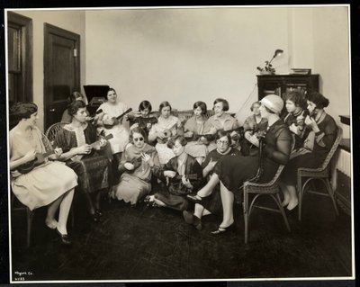 Group of young blind women playing ukeleles at the New York Association for the Blind, 111 East 59th Street, New York, 1926 by Byron Company